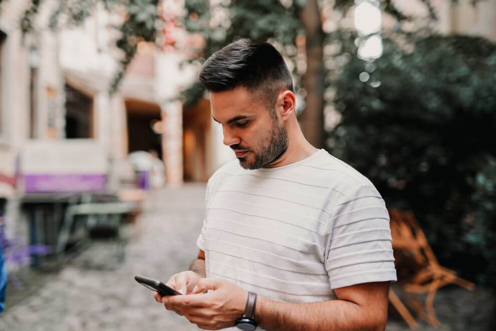 A Man Watches Phone