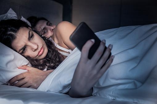 Man Peeks at Woman's Phone Wanting to Know Cheating Wife's Texts