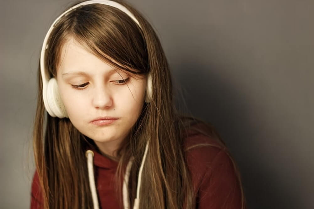 Girl Listening to Uncensored Contents with Headphone