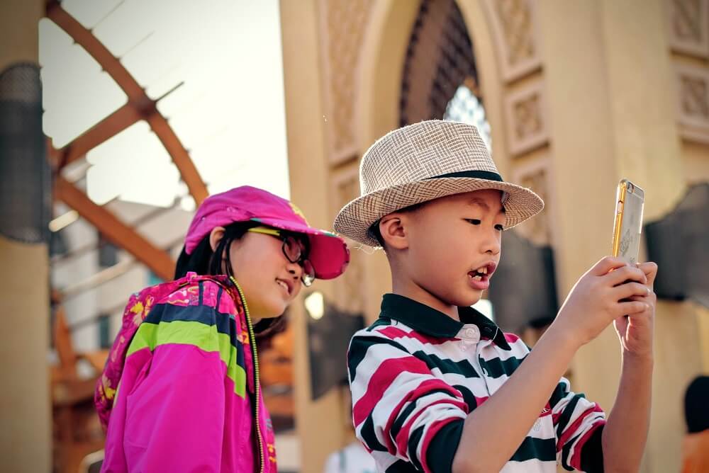 Girl and Boy Taking Photos