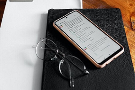 Smartphone Glasses Notebook on Desk